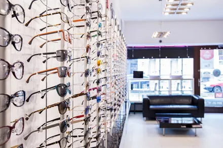 Glasses in a display case at an optical shop.